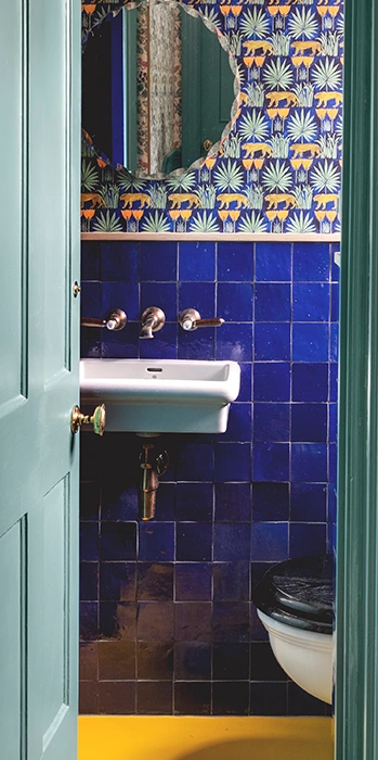 Bathroom featuring blue zellige wall tiles